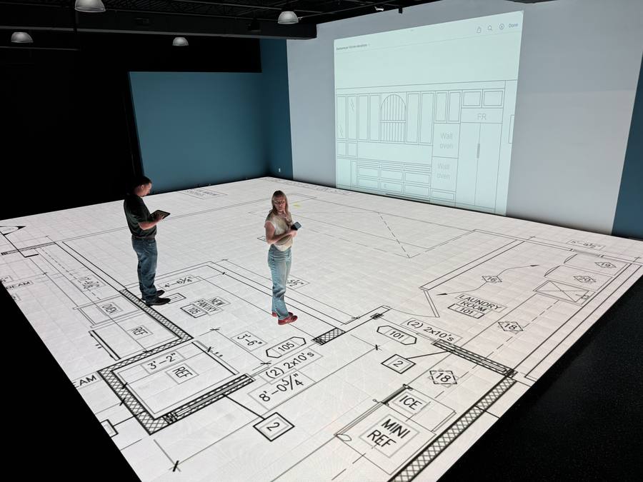 A couple walking their floor plan at full scale