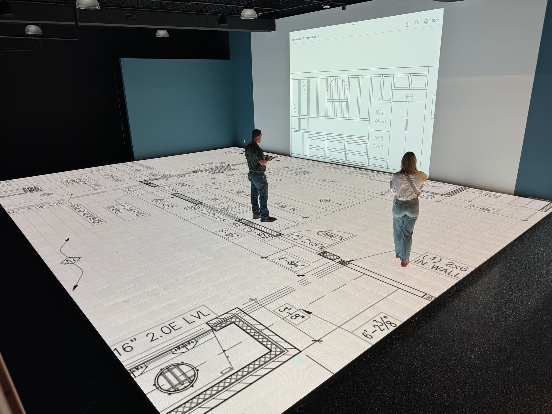 A home floor plan projected at full scale